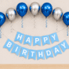 Blue Silver Metallic Birthday Decoration Blue and silver metallic birthday decoration with balloons, ribbon curls and happy birthday banner for party setup.