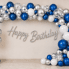 Blue Silver Happy Birthday Balloon Decoration with Cursive Banner Blue, white and silver birthday balloon decoration with metallic balloon arch, silver confetti balloons, floor balloon cluster and silver cursive Happy Birthday banner.