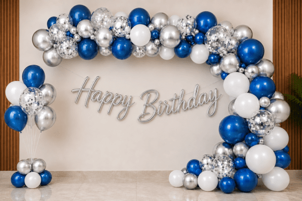 Blue Silver Happy Birthday Balloon Decoration with Cursive Banner Blue, white and silver birthday balloon decoration with metallic balloon arch, silver confetti balloons, floor balloon cluster and silver cursive Happy Birthday banner.