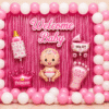 Welcome baby girl decoration with pink and white balloons, pink foil curtain, baby girl foil balloons, girl stand and party backdrop.