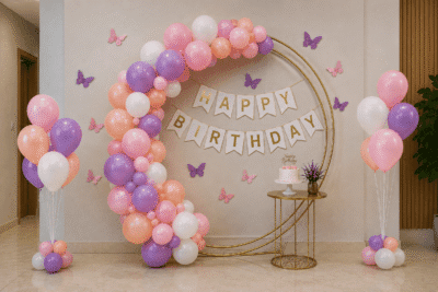 Pastel Pink Birthday Balloon Decoration Pastel pink and white birthday balloon decoration with Happy Birthday banner and balloon arch backdrop