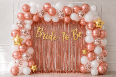 Bride To Be Rose Gold Balloon Decoration Kit with Foil Curtain Bride to be rose gold and white balloon decoration with rose gold foil curtain, gold banner, confetti balloons and gold star foil balloons for bridal shower party.